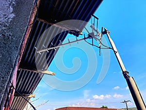 antenna mast at home on a clear sky background