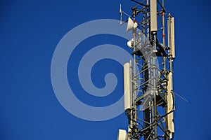 A antenna mast Telekommunikation with blue sky backgound