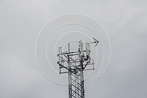 Antenna mast towards an overcast sky