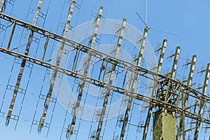 Antenna of modern mobile military radar station on the blue sky background