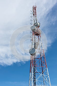 The antenna signal telecommunication tower with blue sky and cloud