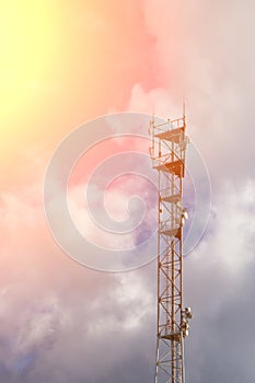 Antenna tower with blue sky and cloud background