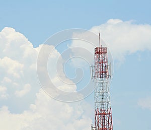 Antenna transmission tower and huge clouds on sky