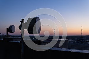 Antennas of a radio-relay data transmission line for mobile networks, in twilight