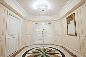 Anteroom with double door and mosaic marble floor