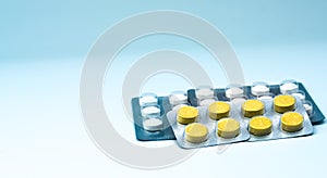 Anthelmintic tablets pills in blister packs on white background with copy space. Pharmaceutical industry concept. photo