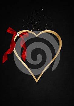 Anthracite background with luxery golden heart and red ribbon. Valentines day illustration