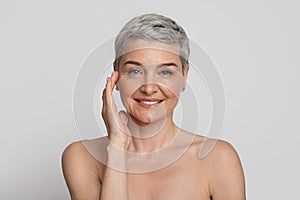 Anti-Age Treatment. Portrait Of Attractive Nude Mature Woman With Beautiful Skin