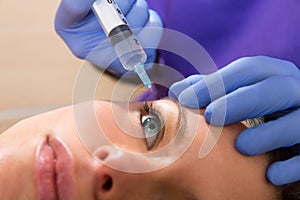 Anti aging facial mesotherapy syringe on woman face