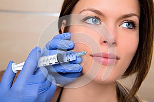 Anti aging facial mesotherapy with syringe closeup woman face