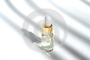 Anti aging serum with collagen and peptides in glass bottle with dropper
