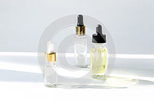 Anti aging serum with collagen and peptides in glass bottles with dropper