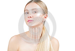 Anti-aging treatment and face lifting. Beautiful woman with perfect skin  with arrows on neck photo