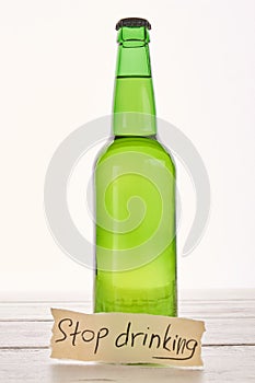 Anti alcoholism concept, wooden background.