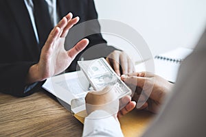 Anti bribery and corruption concept, Business man refusing and don `t receive money banknote offered from business people to accep