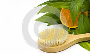 Anti-cellulite massage brush on a white background. Orange peel cellulite concept. Lymphatic drainage massage. Place for text.