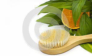 Anti-cellulite massage brush on a white background. Orange peel cellulite concept. Lymphatic drainage massage. Place for text. photo