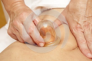 Anti cellulite massage with Ventuza vacuum body puller photo