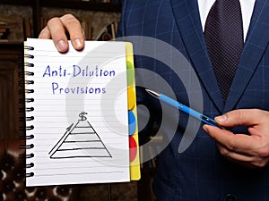 Anti-Dilution Provisions phrase on the white notepad