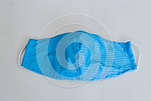 Anti dust cloth face mask help people avoid getting sick. In blue color on white background.