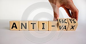 Anti-facts or anti-vax symbol. Doctor turns a cube  changes words \'anti-vax\' to \'anti-facts\'.