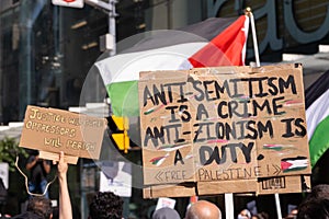 Anti-Israel signs at Pro-Palestine event, Toronto, Ontario