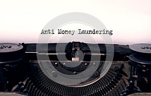 anti money laundering typed words on a vintage typewriter
