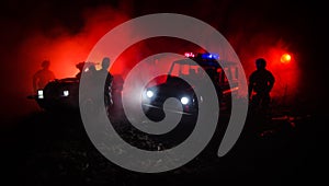 Anti-riot police give signal to be ready. Government power concept. Police in action. Smoke on a dark background with lights. Blue
