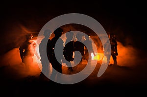 Anti-riot police give signal to be ready. Government power concept. Police in action. Smoke on a dark background with lights. Blue