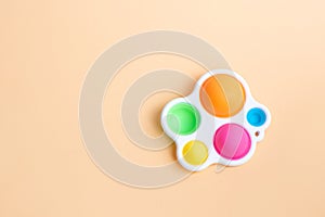 Anti-stress sensory fidget toy simple dimple on pastel background . Macro image. Shadow
