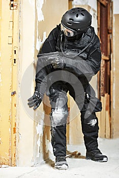 Anti-terrorist police soldier armed with pistol ready to attack