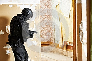 Anti-terrorist police soldier armed with pistol ready to attack