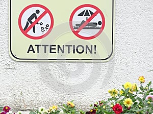 Anti-vandal prohibition signs in a public park. You can\'t trample on flowers!