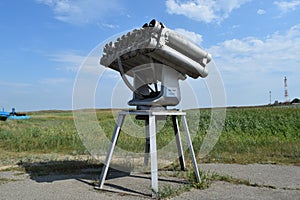 Antiaircraft missile launcher on the pedestal with the feet. Fixed artillery. Open-air museum