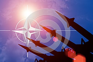 Antiaircraft rockets silhouettes on background of NATO