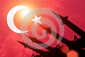 Antiaircraft rockets silhouettes on background of Turkey flag.