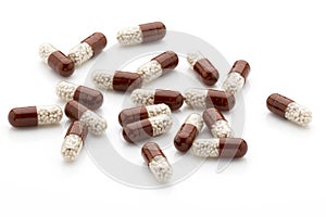 Antibiotic capsules on a white background.