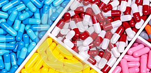Antibiotic drugs. Top view of painkiller capsule pills and supplements capsule in plastic tray. Pharmaceutical industry. Pharmacy