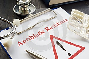 Antibiotic resistance sign and pills on it.