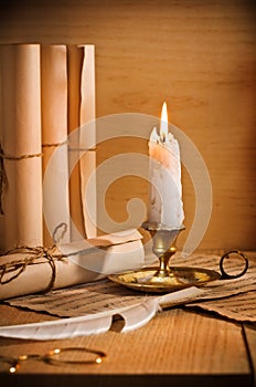 Antic candle with rool of paper
