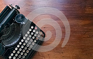 Ancient typewriter on vintage background photo