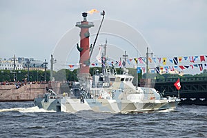 The antidiversionary boat `Grachonok` type against the background of the Rostral column. A fragment of a military parade in honor