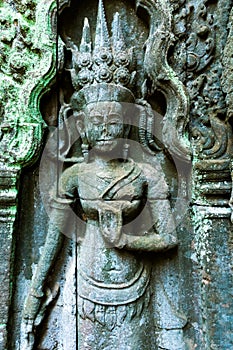 Antient reliefs of dancer, Ta Prohm Temple in Angkor Wat complex, Cambodia