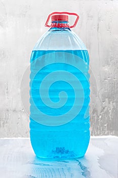 Antifreeze liquid. frost-resistant windshield washer fluid bottle isolated