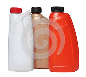 Antifreeze in plastic bottles isolated on white