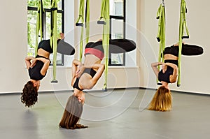 Antigravity yoga exercise. group of girls