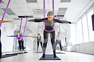 Antigravity yoga, group training with hammocks