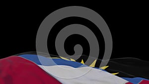 Antigua and Barbada fabric flag waving on the wind loop. Antigua and Barbada embroidery stiched cloth banner swaying on the breeze