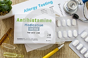 Antihistamine medication or allergy drug concept photo. On doctor table is pack with word `Antihistamine medication` and pills for