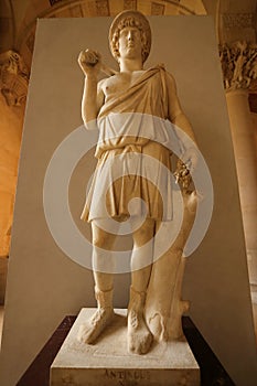 Antinous as Aristaeus statue at Louvre museum in Paris